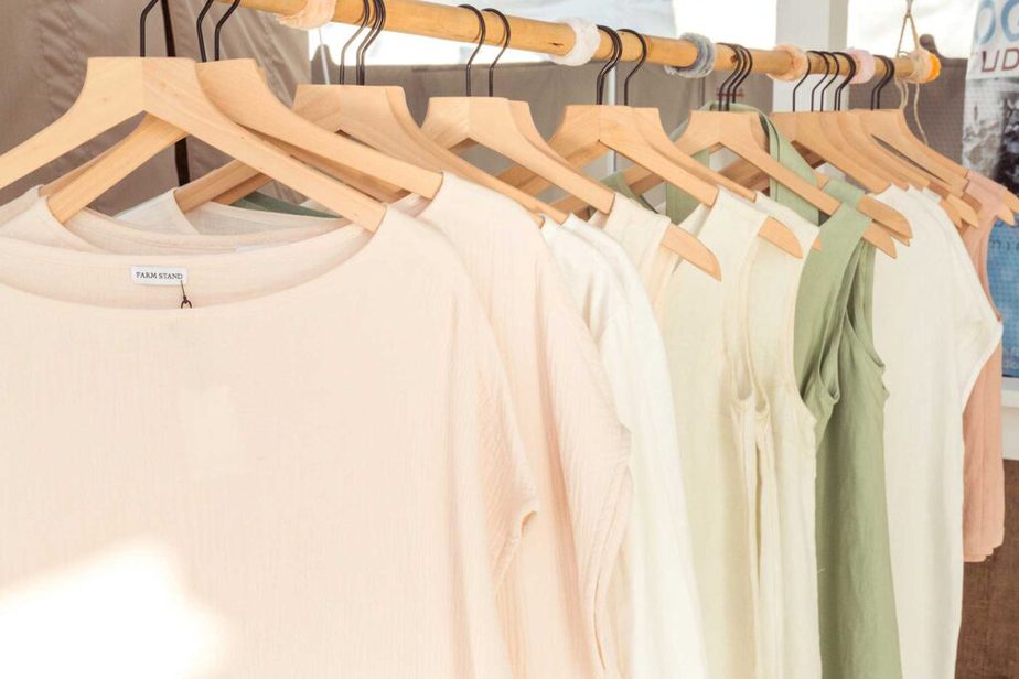A rack of pastel shirts sold at Farm Stand.