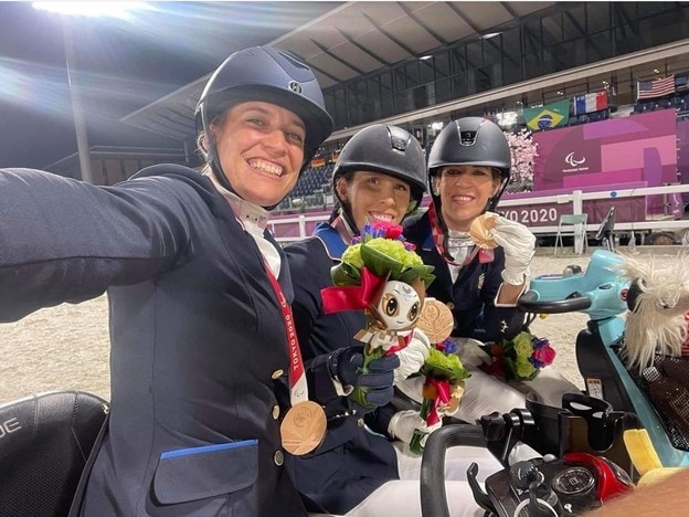 Para Dressage Team USA showing off their bronze medals at the Tokyo 202 Paralympic Games.
